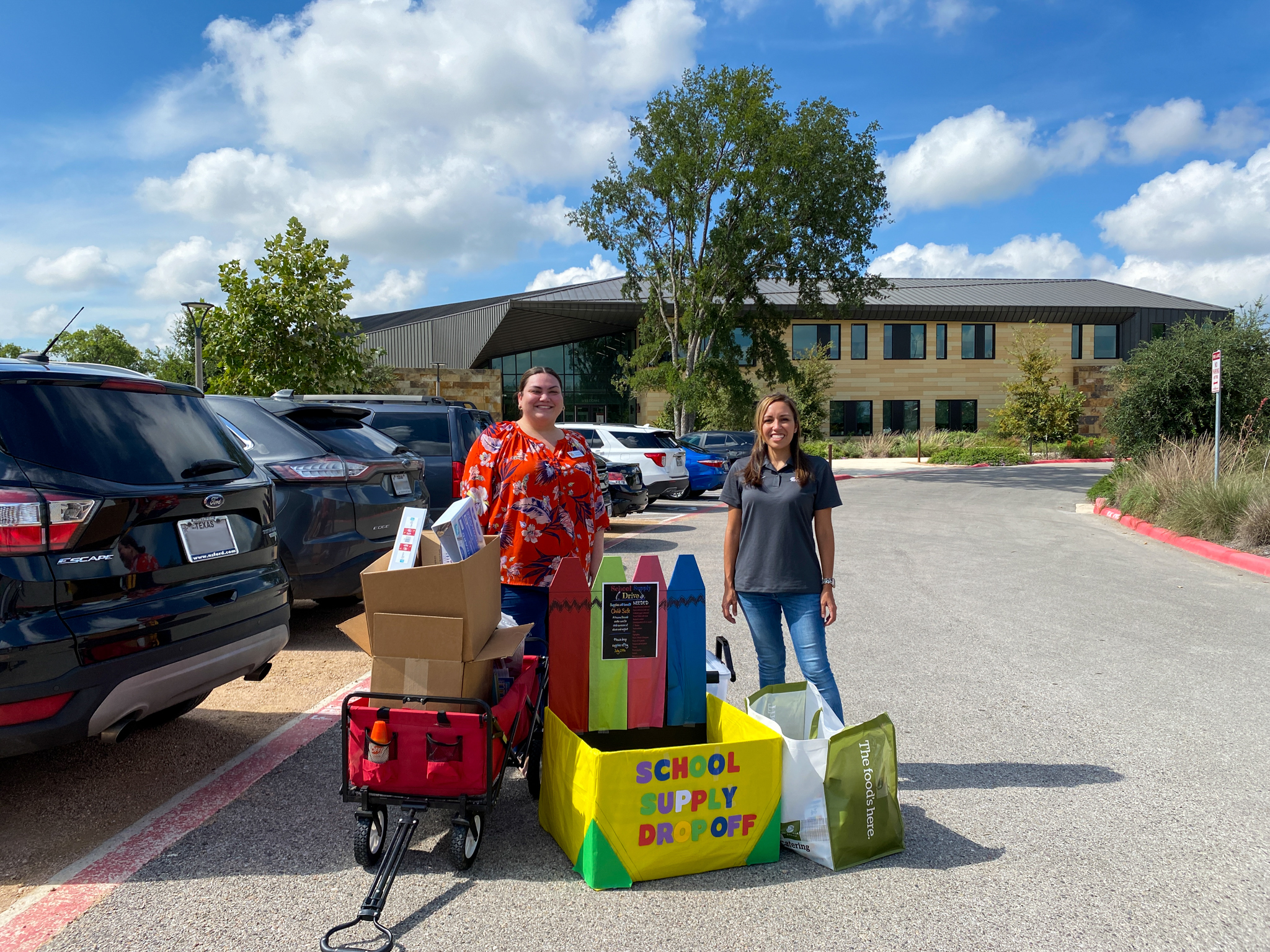 CDS Muery and ChildSafe representatives surrounded by the school supplies donations at ChildSafe. 