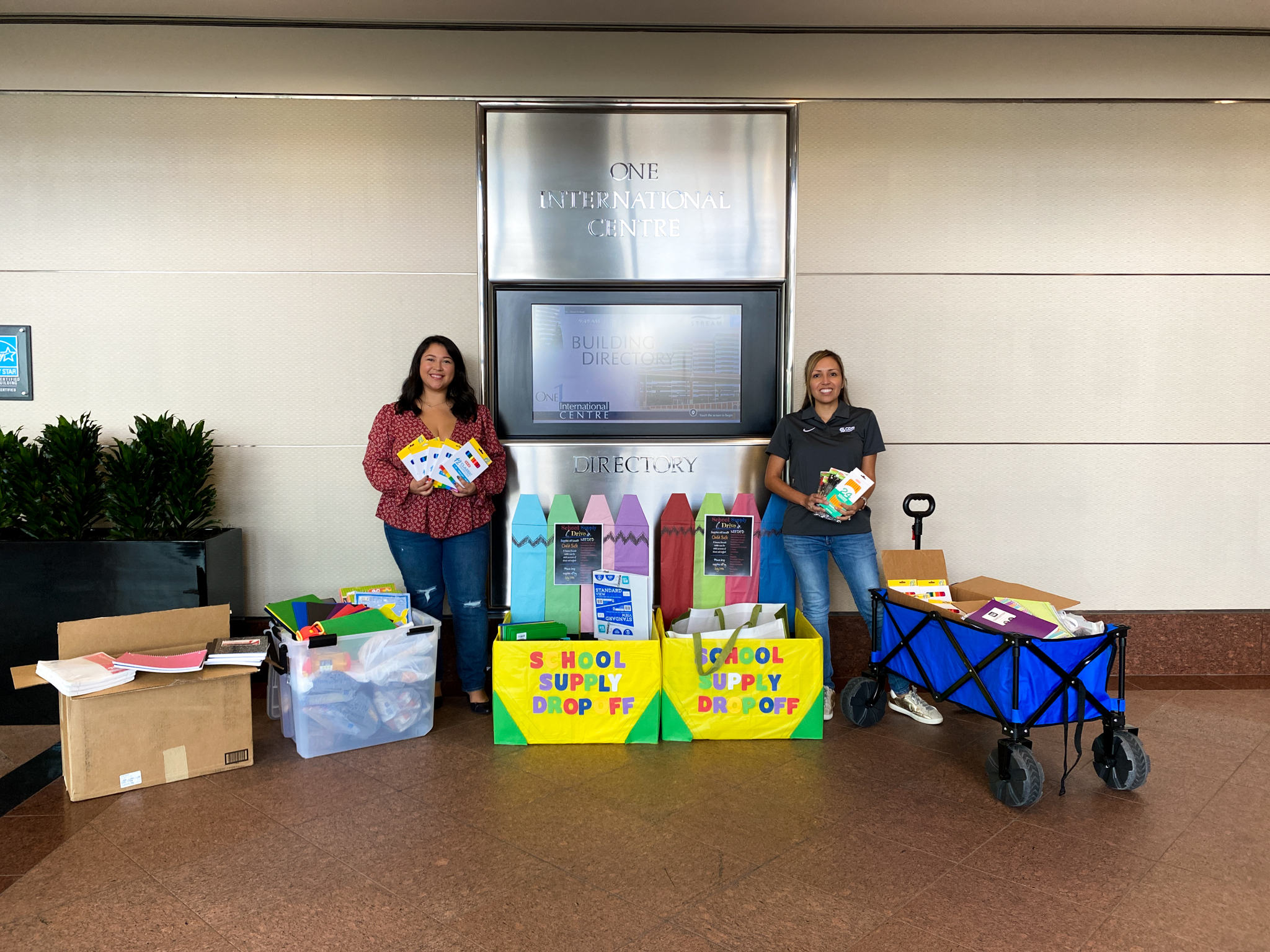 CDS Muery and Stream representatives surrounded by the school supplies donations in the lobby. 